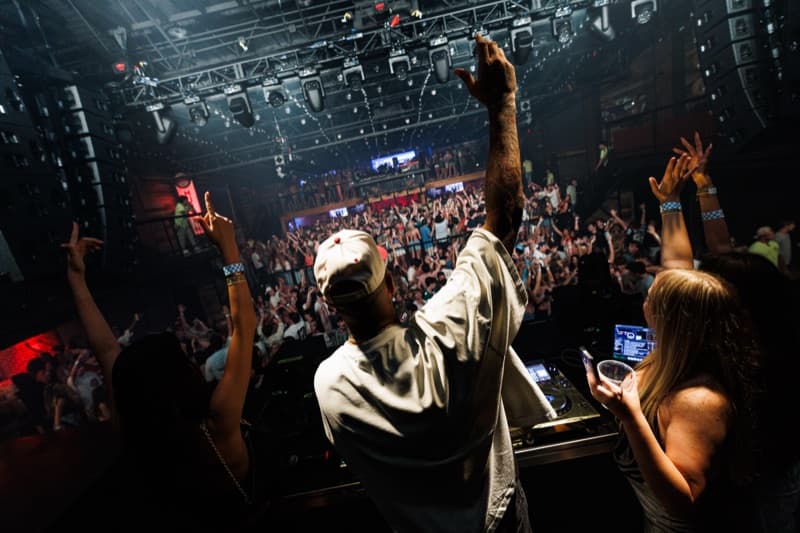 Two Dimes crowd beneath the venue's stage lighting